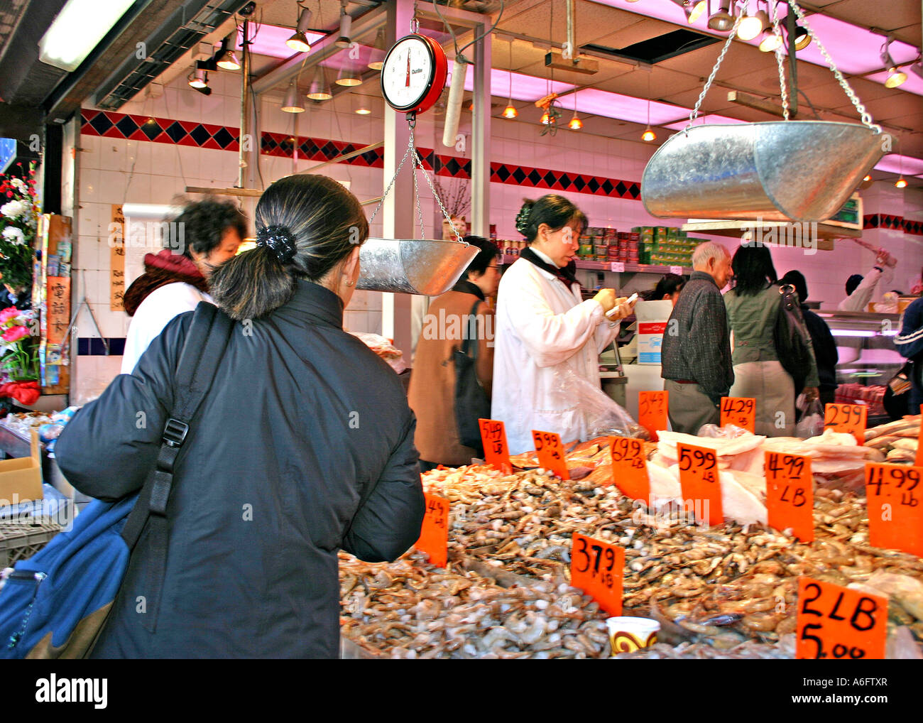 Ethnic people shopping seafood market on Canal Street Chinatown New