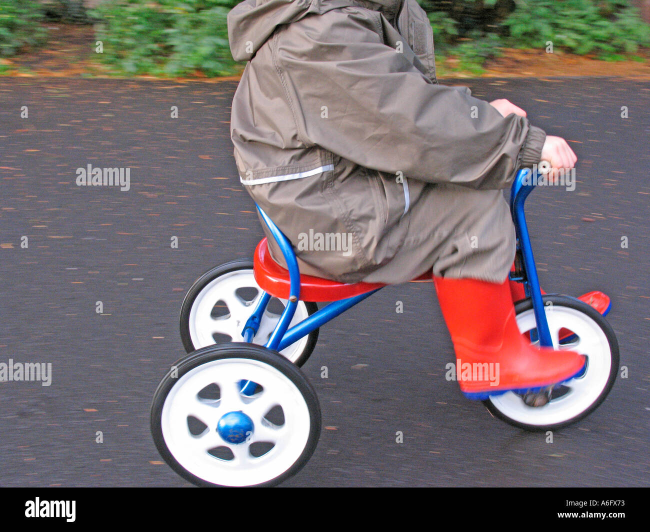 Child on a tricycle Stock Photo Alamy