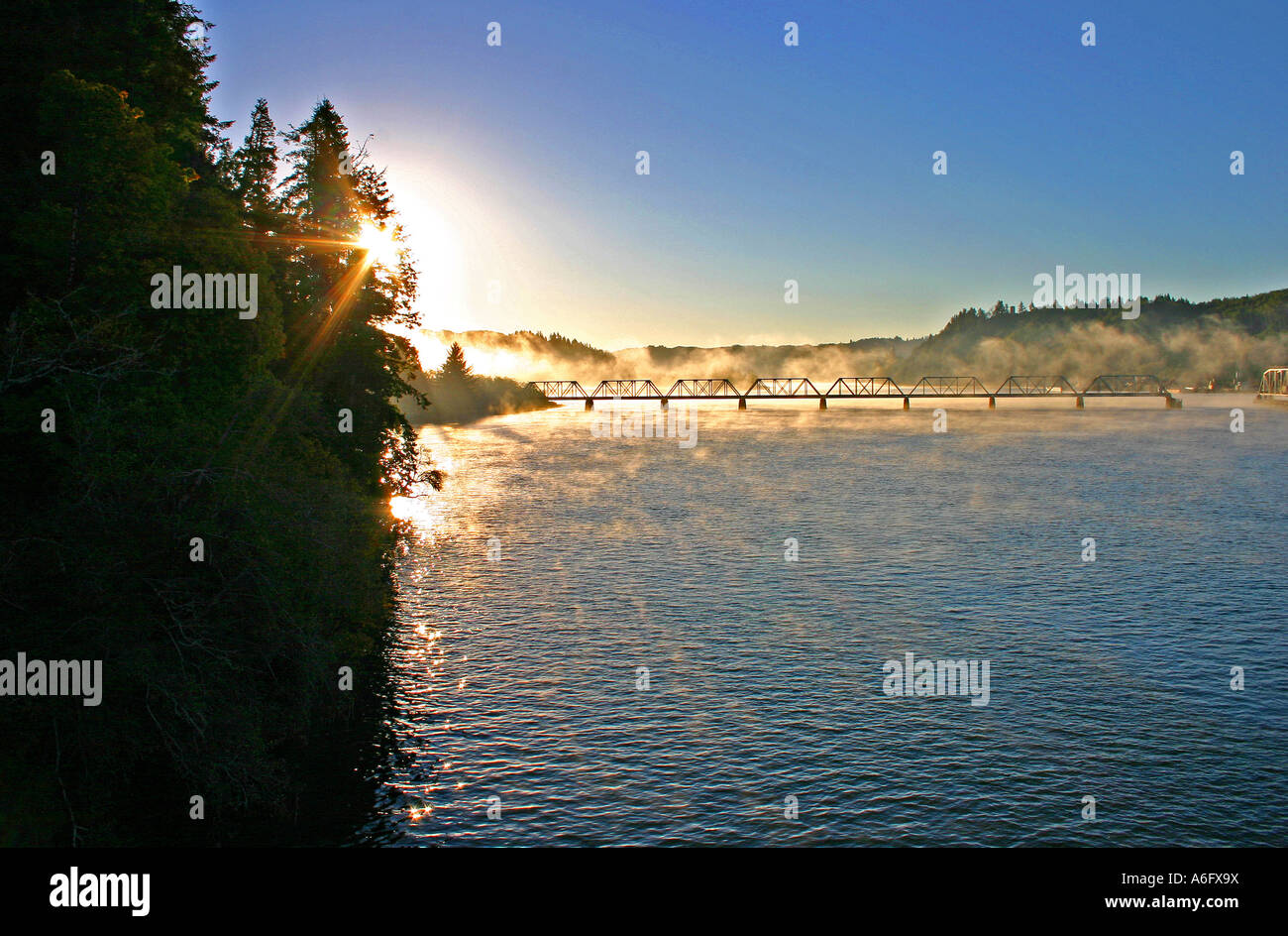 Dawn train bridge over Smith River Reedsport Oregon Stock Photo Alamy