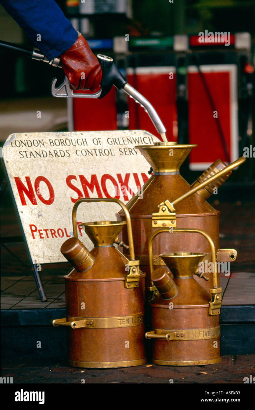 Consumer Protection check volumes of fuel on sale at petrol or gas station. Stock Photo