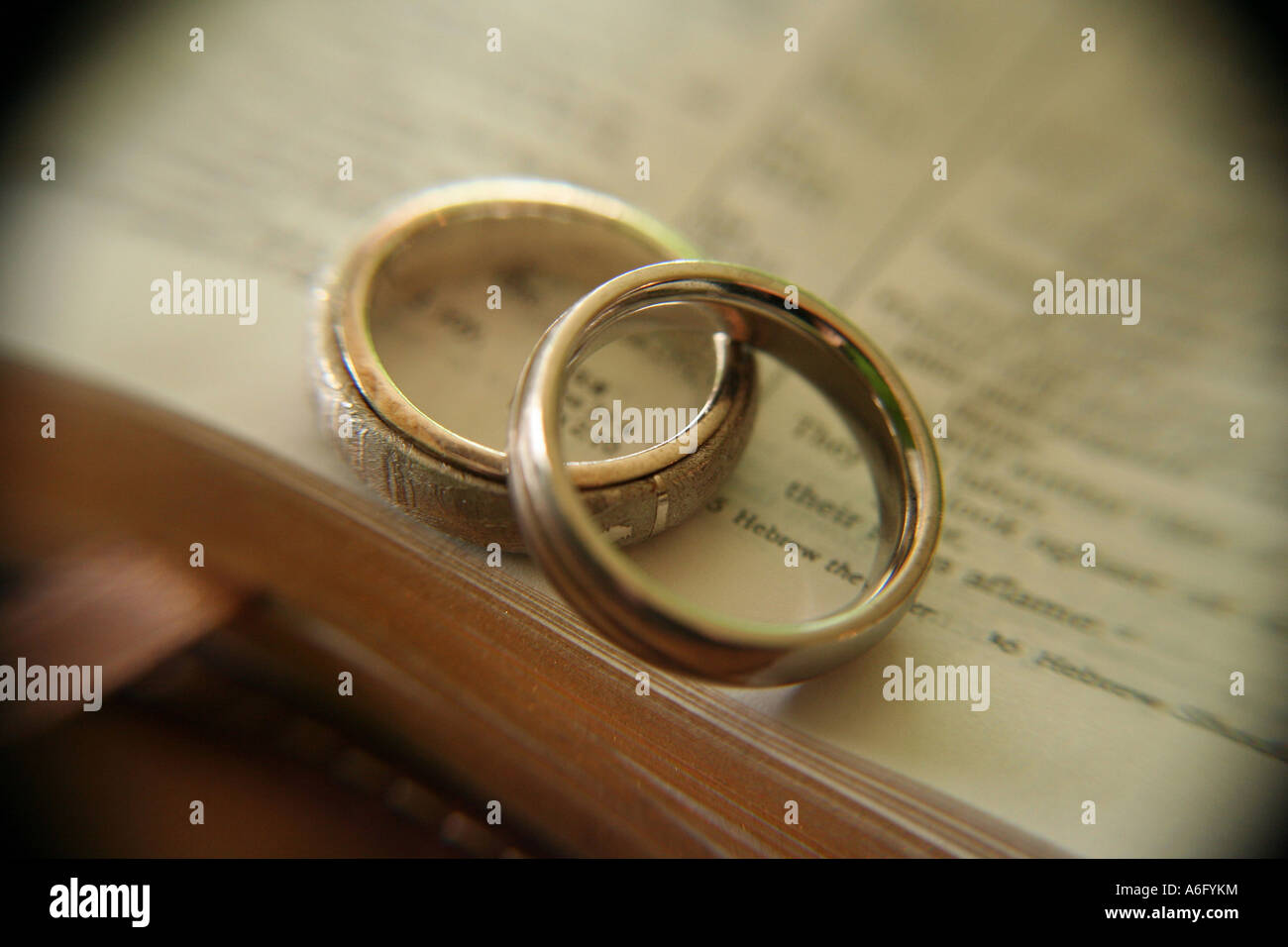Wedding ring on open bible hires stock photography and images Alamy