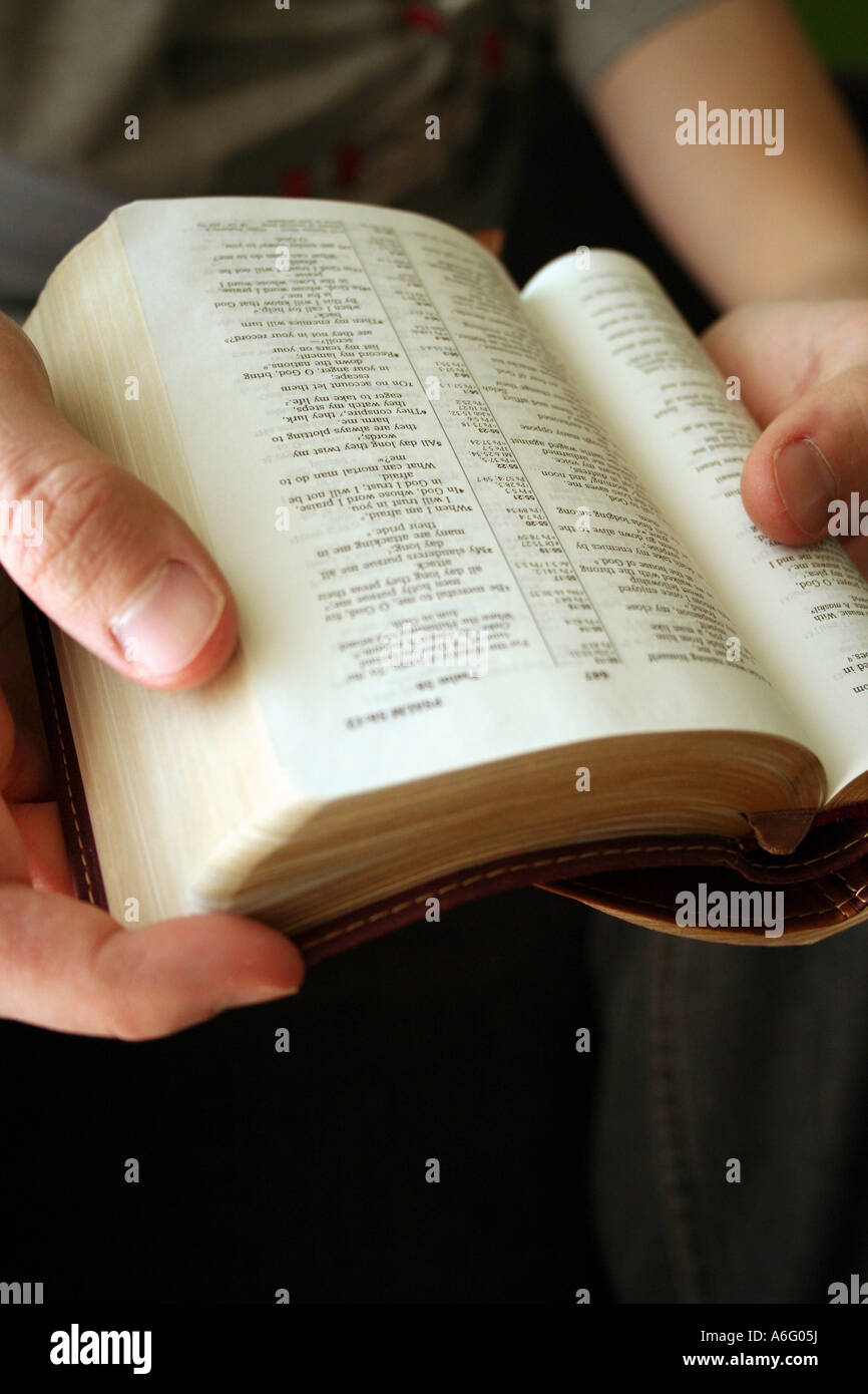 Young blond man reading the Bible Stock Photo