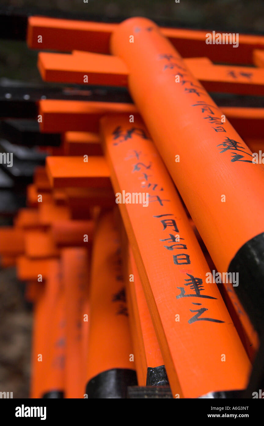 Japan Central Honshu Kansai Kyoto Fushimi Inari Taisha shrine Most popular for its orange toriis close up of a row of orange tor Stock Photo