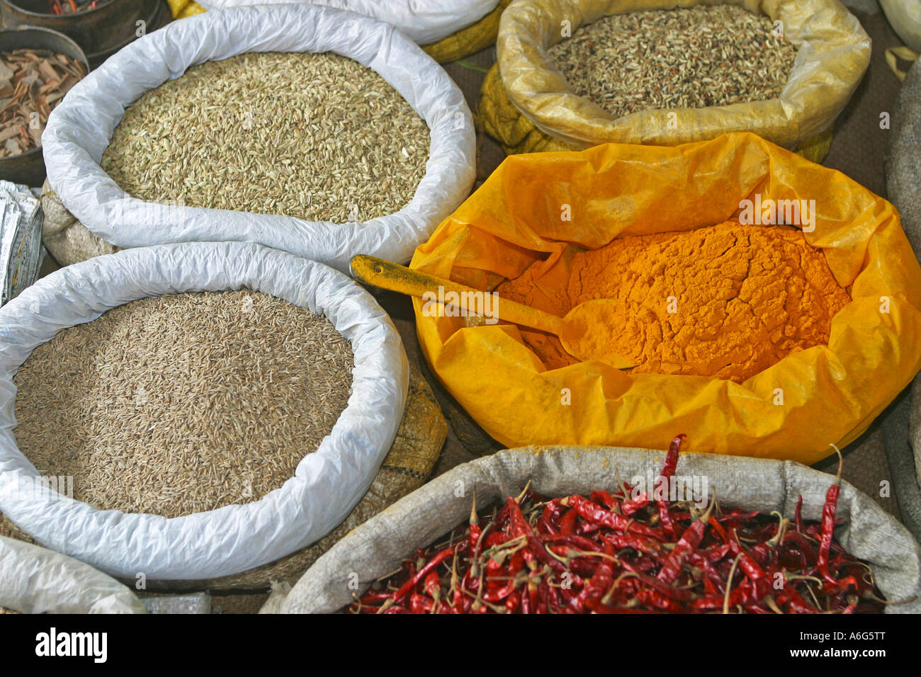 Rice, saffron, chilies in bags at the market in Chatra, Westbengalia, India Stock Photo