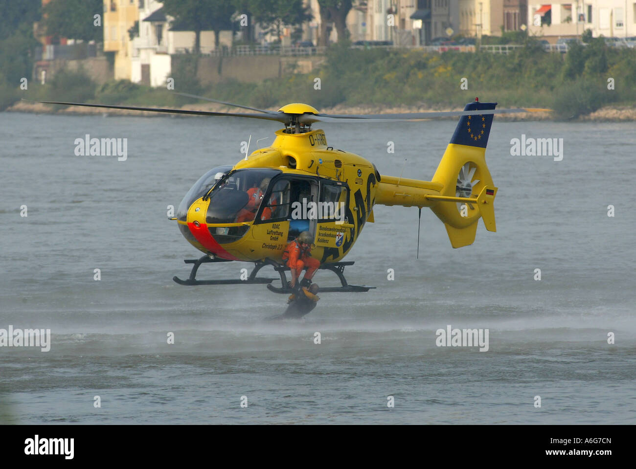 A rescue helicopter of the ADAC is training to rescue people out of the river rhine near Koblenz, Rhineland-Palatinate, Germany Stock Photo