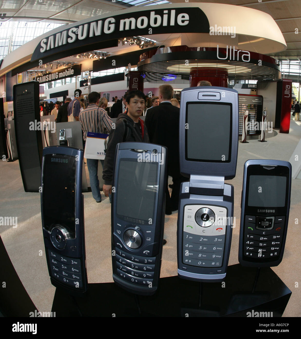 Mobile phone in front of the samsung stand during the Cebit in Hannover, Lower Saxony, Germany. Stock Photo