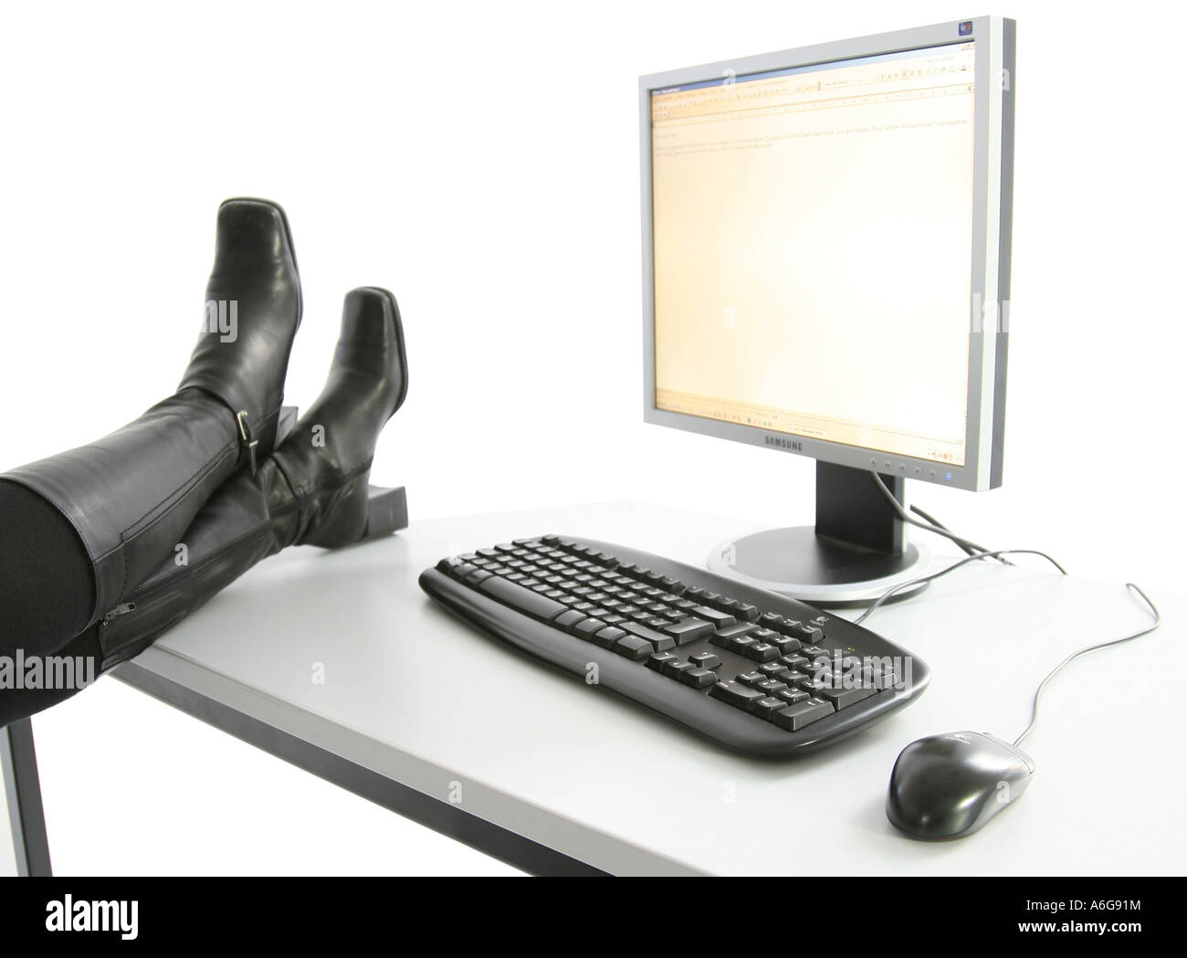 computer workstation with boots during a break Stock Photo Alamy