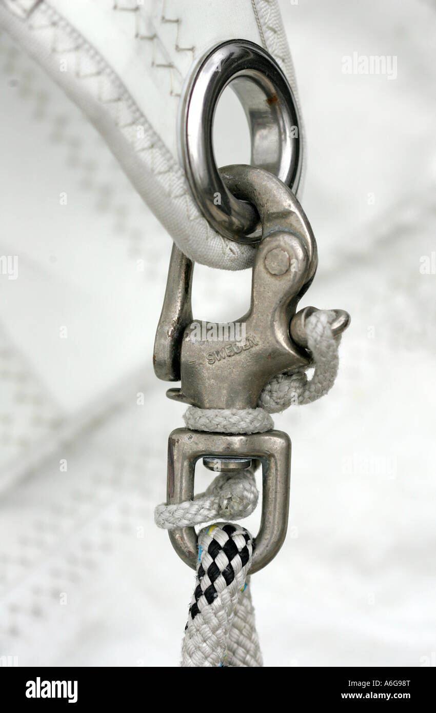 Carabiner inside an eyelet of a sail Stock Photo