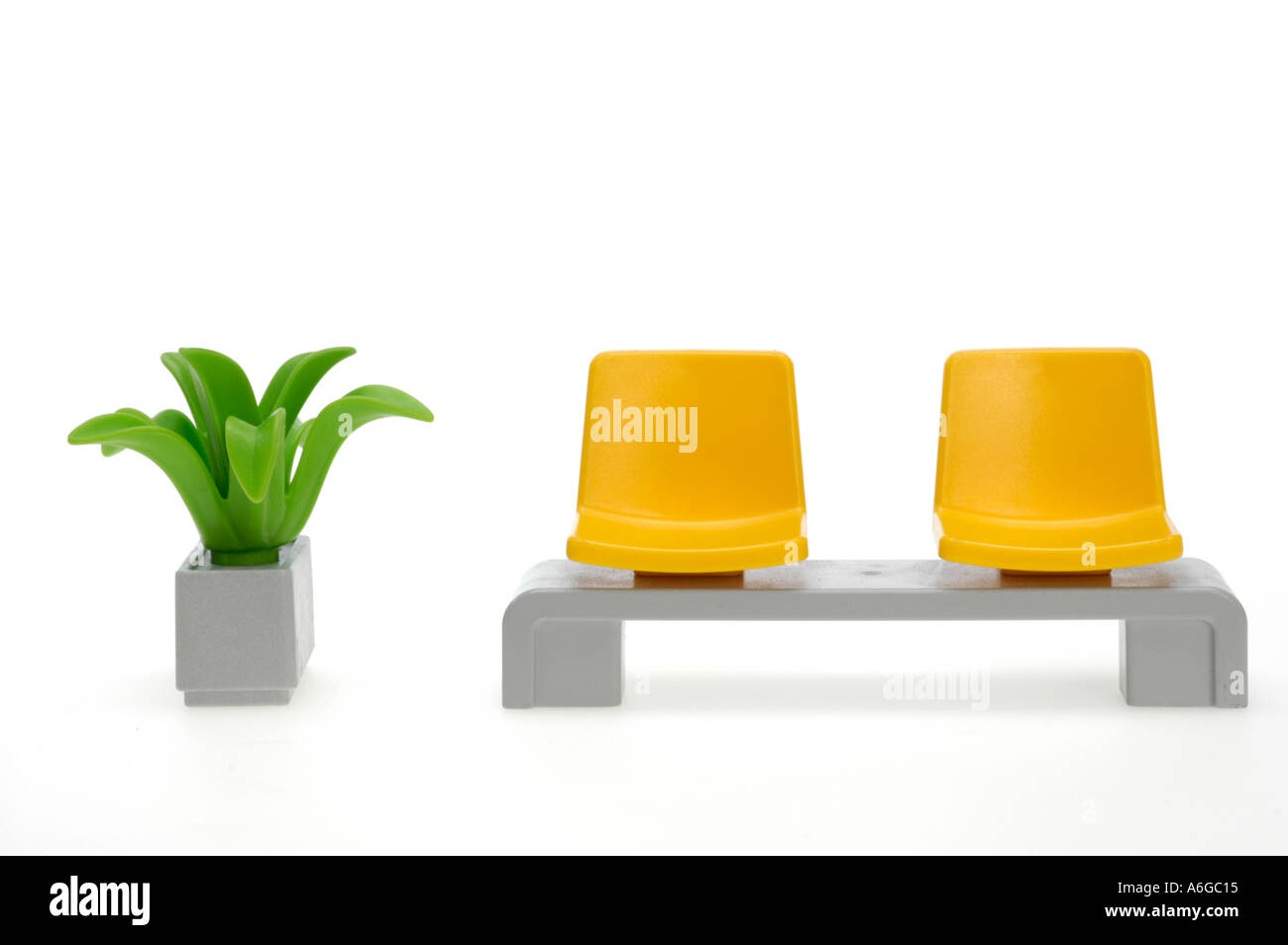 wainting area, yellow chairs, plastic flowers Stock Photo