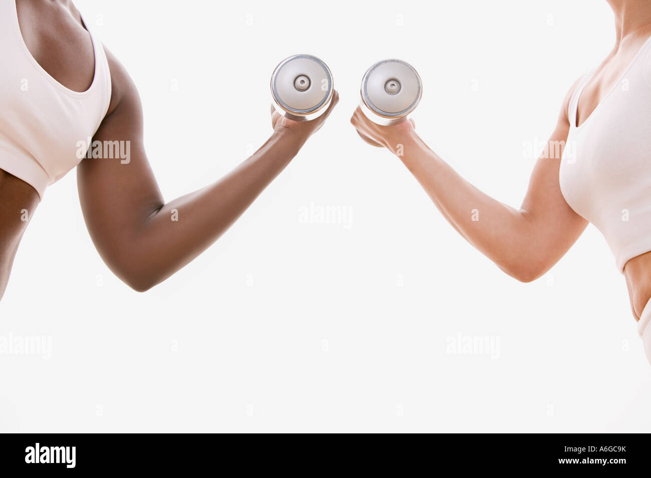 Two women weightlifting Stock Photo