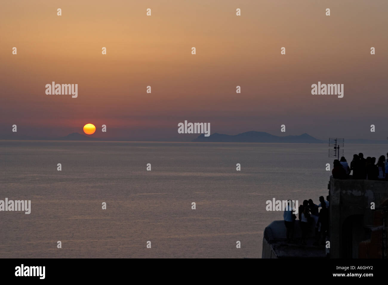 Sunset with sun setting Stock Photo