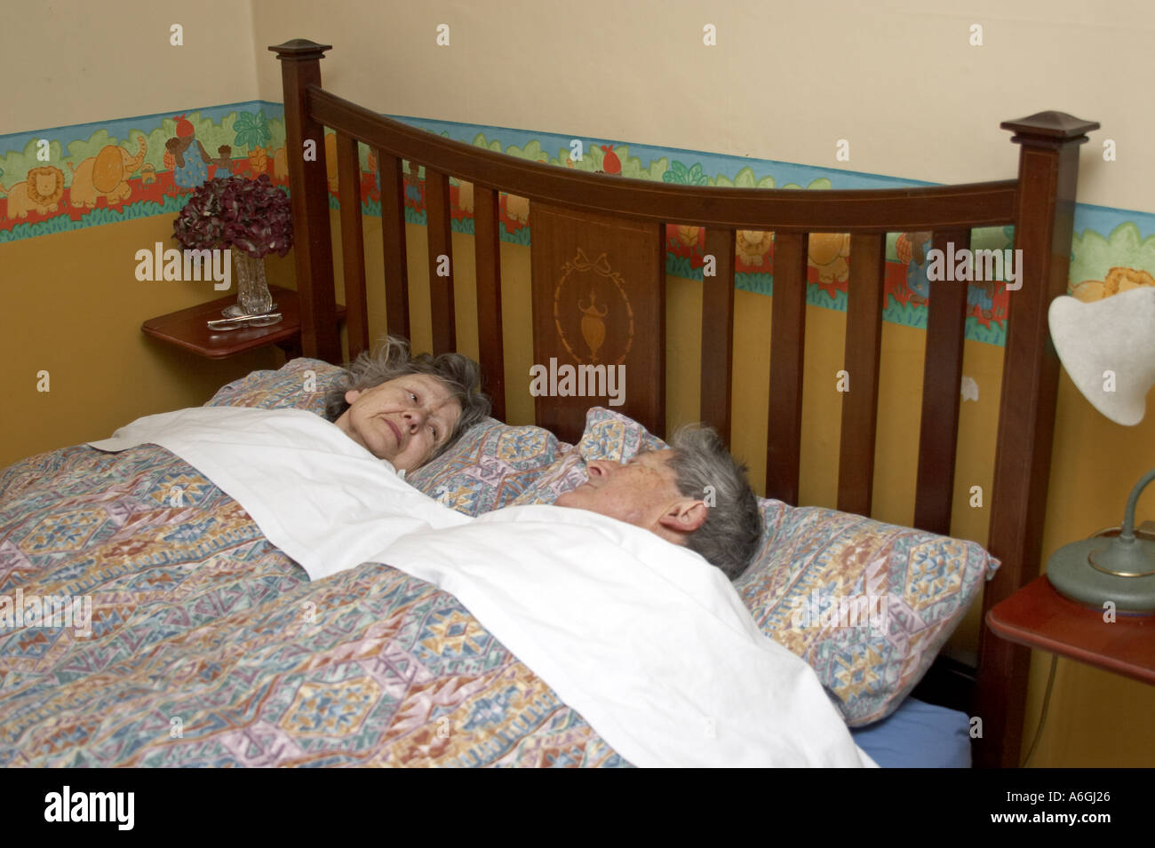 Old or elderly couple of grandparents in bed Stock Photo Alamy