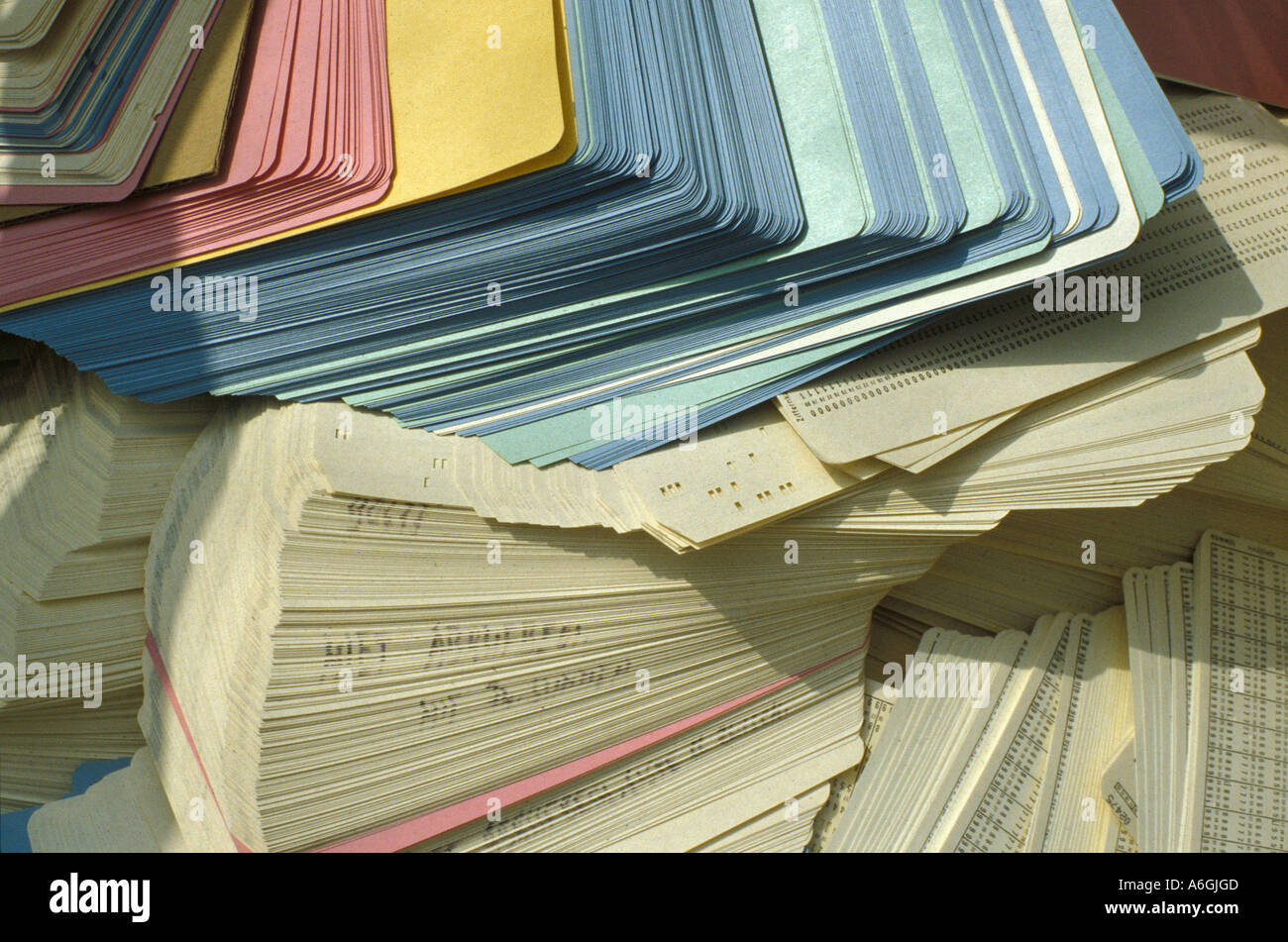 Heap of thrown away perforated cards (punched cards, punchcards) Stock Photo