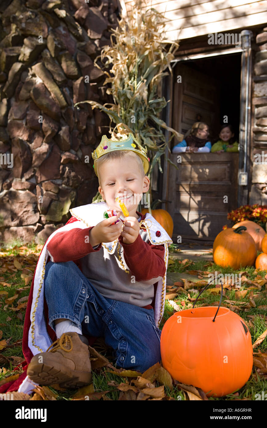 Boy in costume with sweets Stock Photo