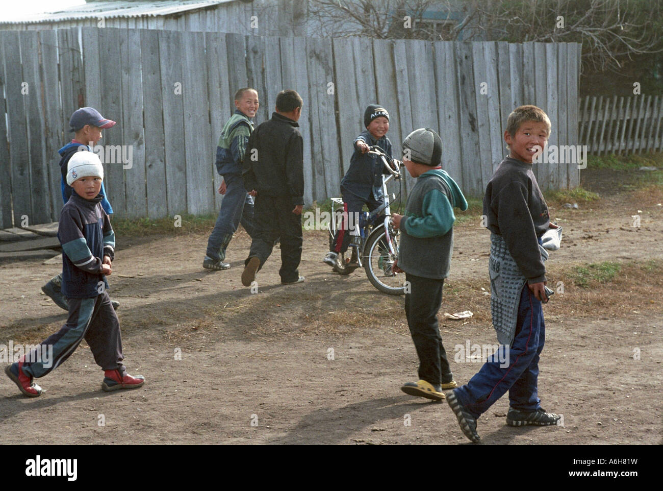 Boys playing in rural street. Ii (Iy) village. Todja Kozhuun. The Tyva (Tuva) Republic. Russia Stock Photo