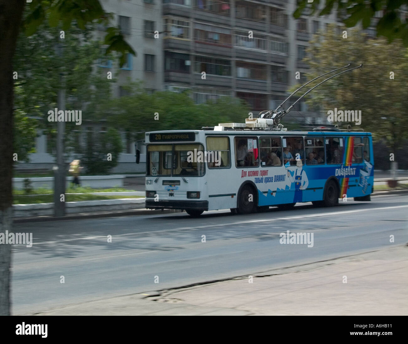 Single decker electric trolley bus with roof mounted trolley poles, in