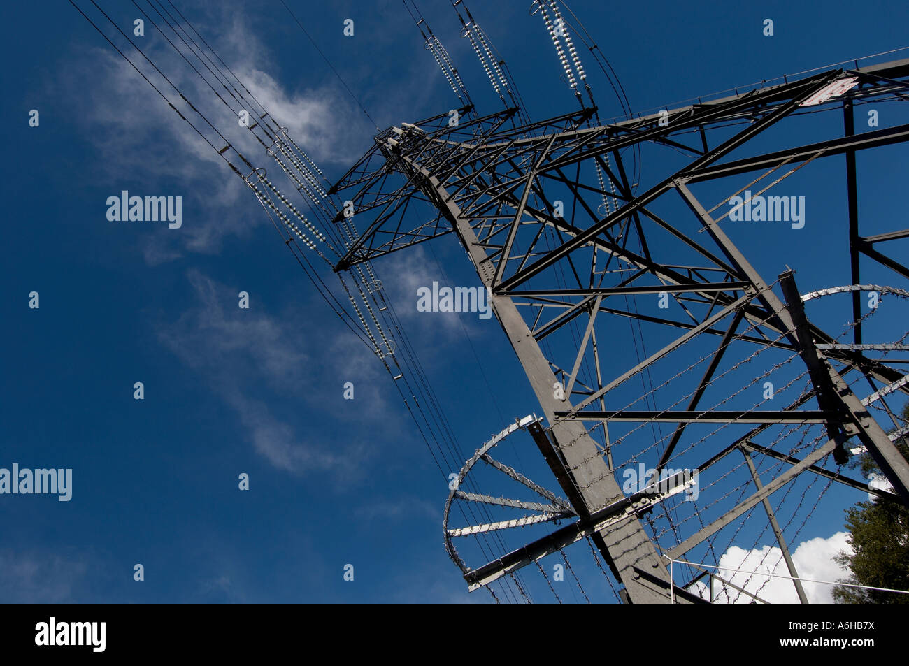 Electricity pylon and blue sky Stock Photo - Alamy