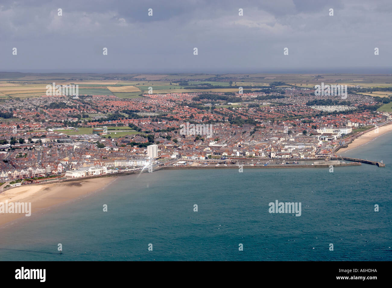 High level oblique aerial view of Bridlington town beach and bay on