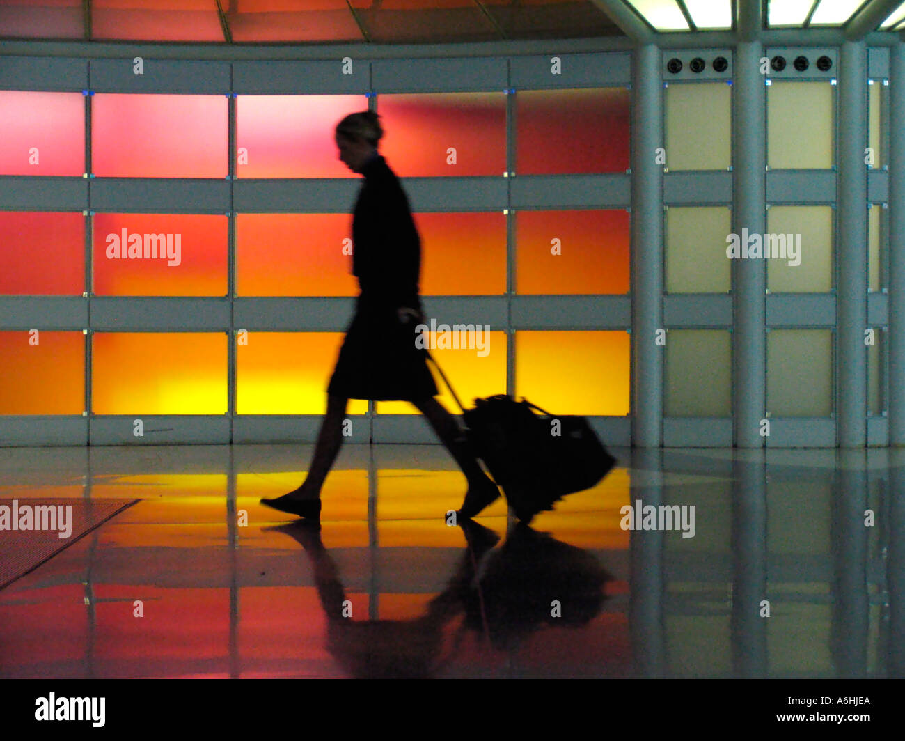 Airline employee with wheeled trolley United Airlines terminal tunnel