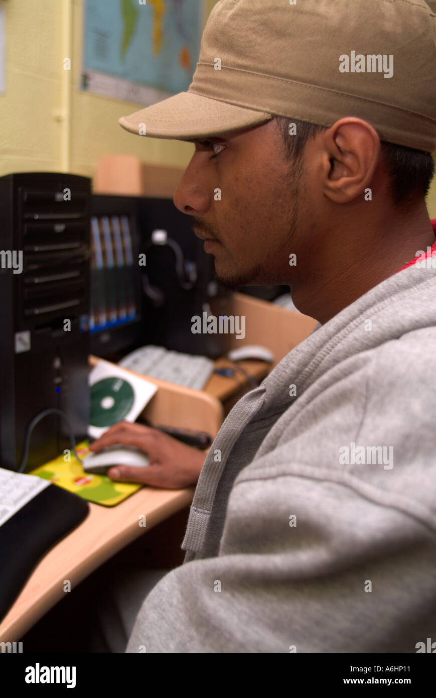 Young man working at a computer, London UK Stock Photo