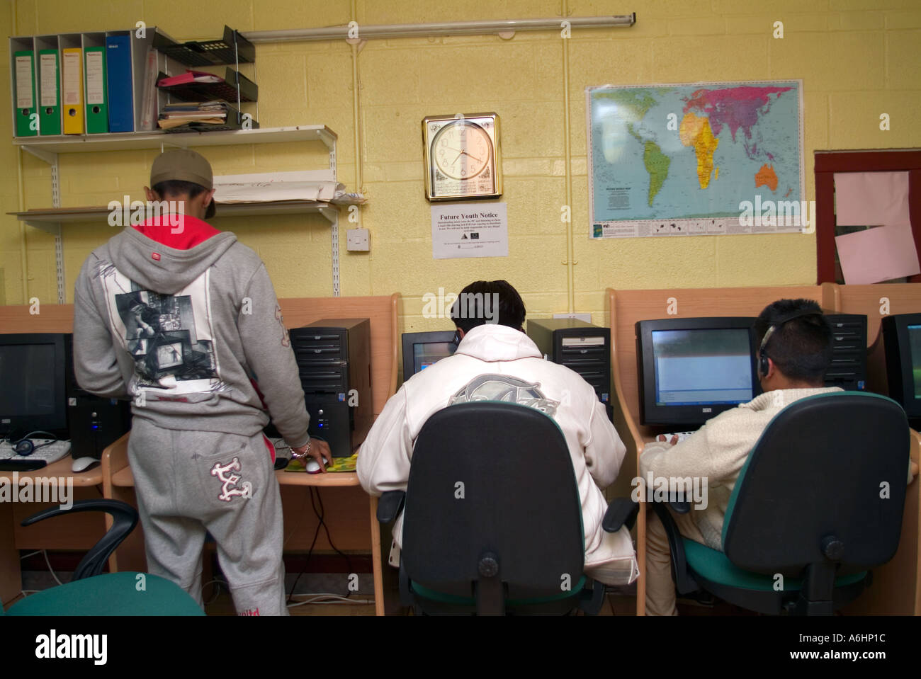 Youths working at a computer in an east end youth club, London, UK. Stock Photo
