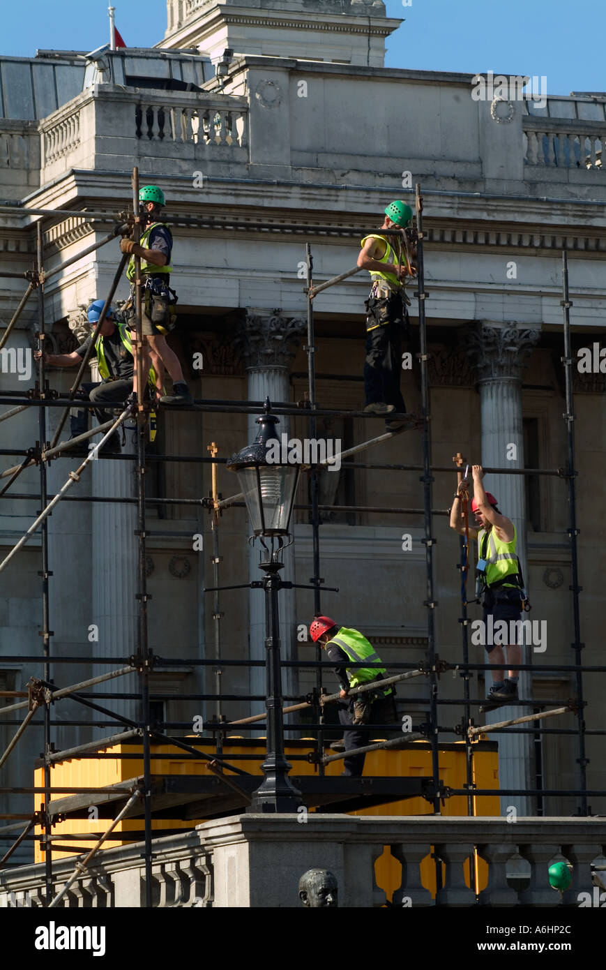 Workmen aloft scaffolding in central London, England Stock Photo Alamy