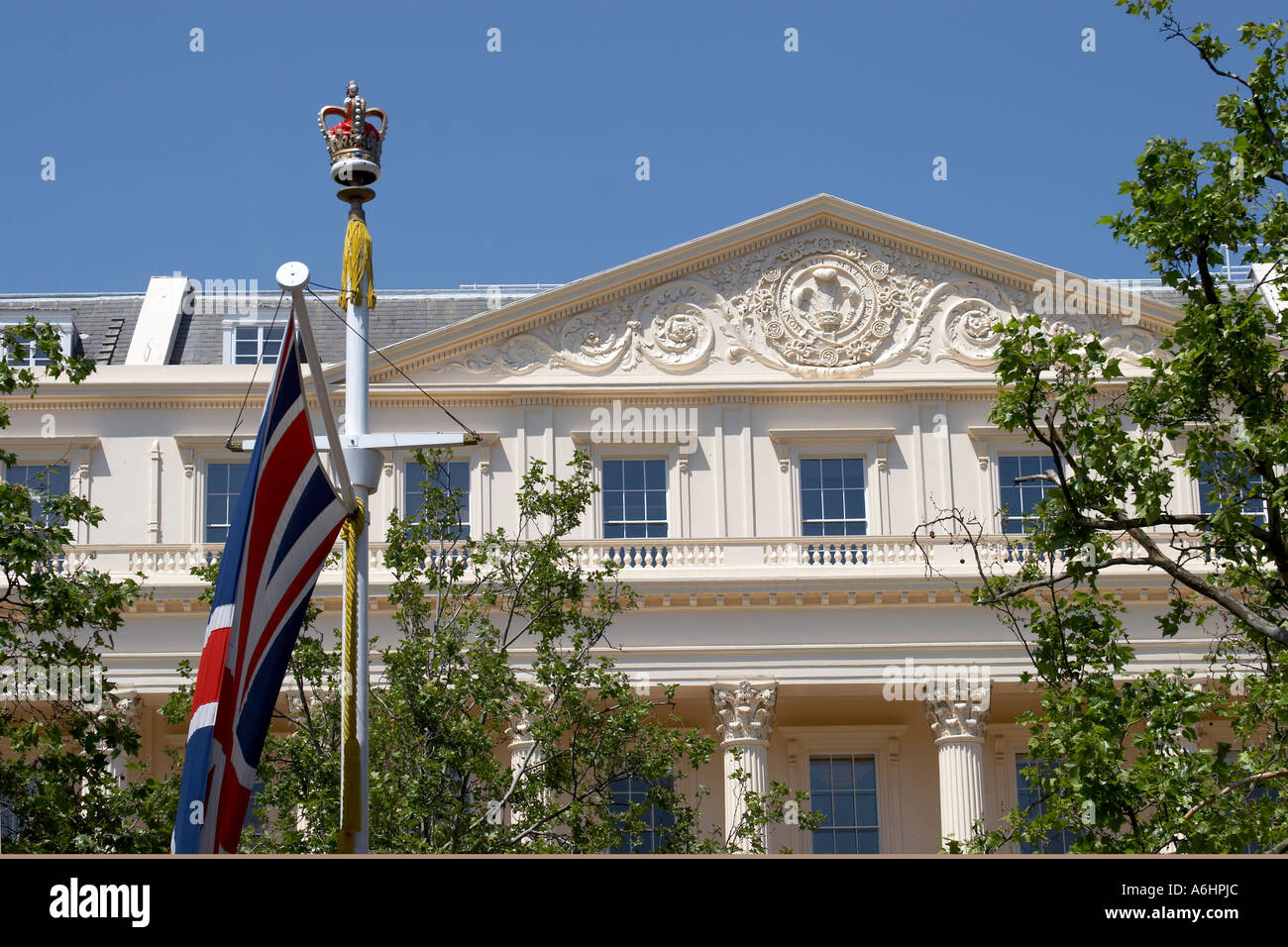 Union Jack flag on the Mall with plane trees and Carlton House Terrace