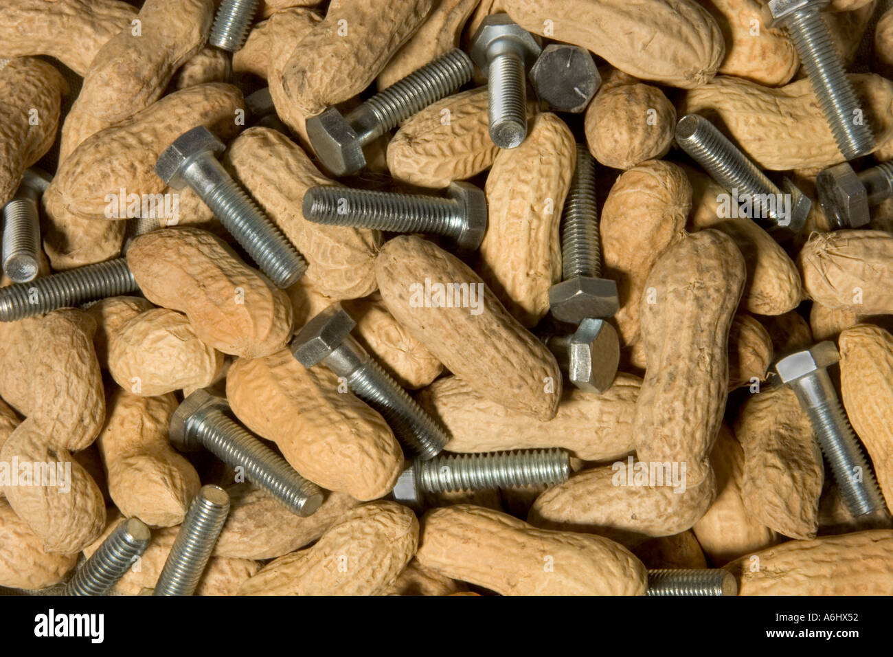 Full frame of peanuts and 1 4 bolts illustrating the common expression