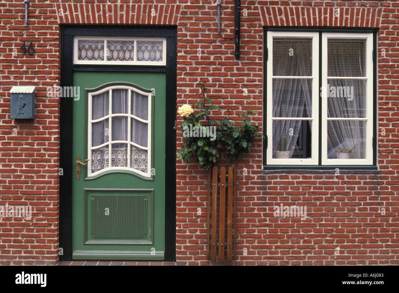 Green Door in Red Brick House Stock Photo - Alamy