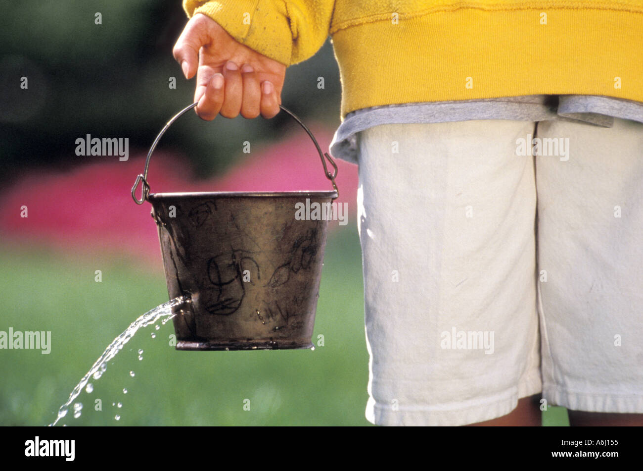 Bucket With a Hole in it Stock Photo Alamy