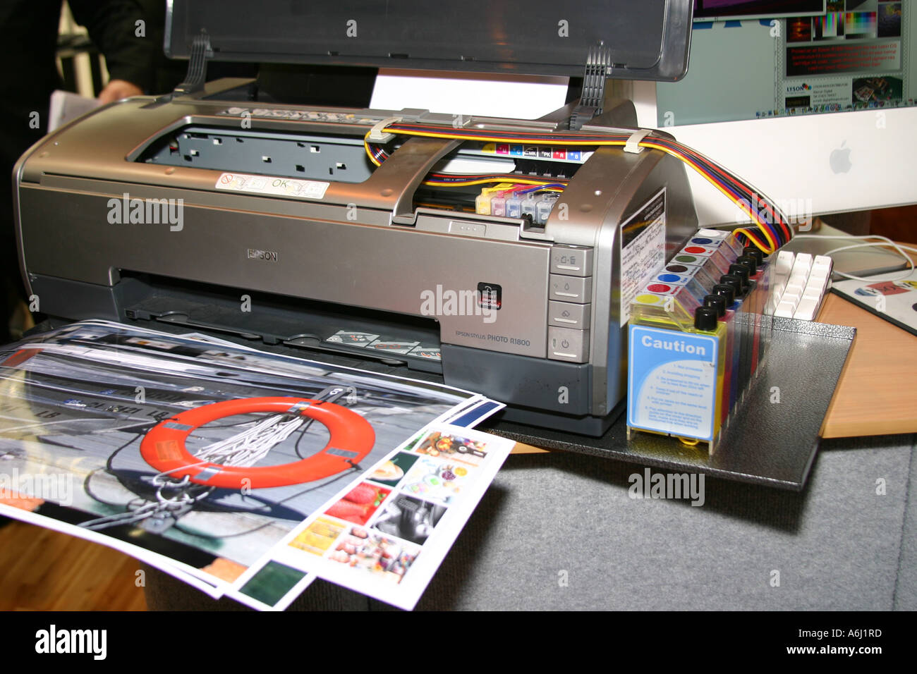 Close shot of cartridge replacement and supply pipes in a bulk ink