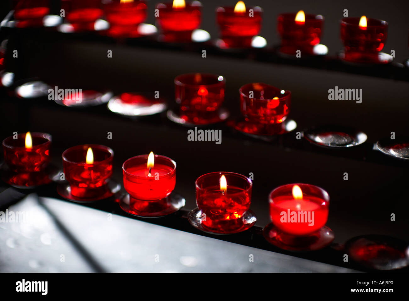 Candles burning in a church Stock Photo Alamy