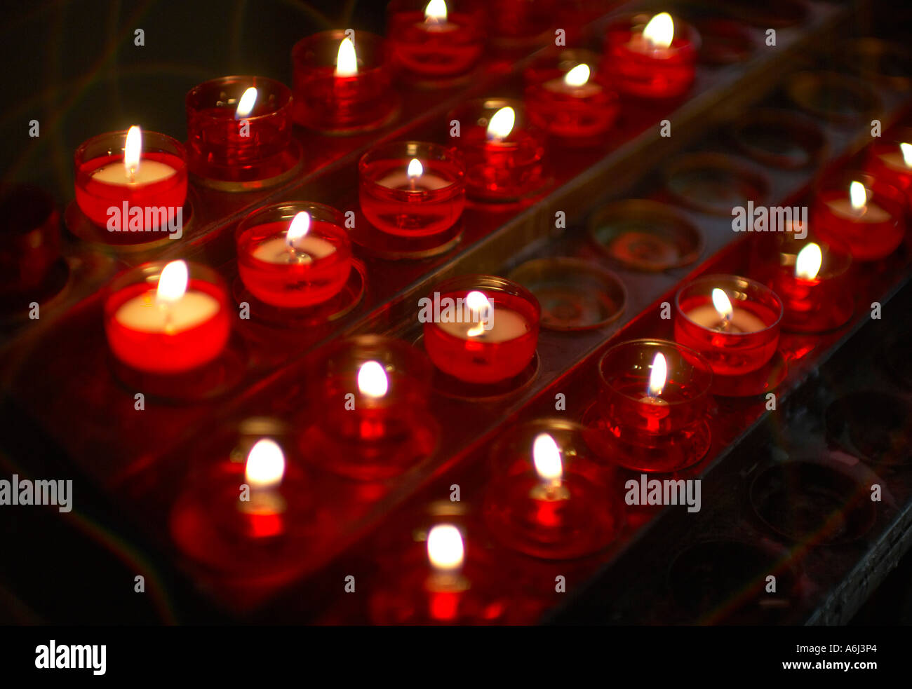Candles burning in a church Stock Photo Alamy
