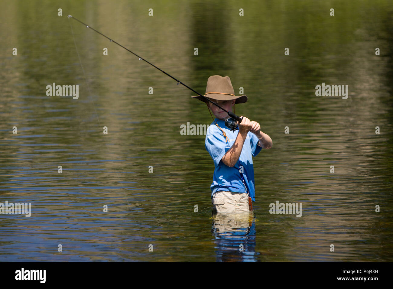 Ten year old boy fishing hi-res stock photography and images - Alamy