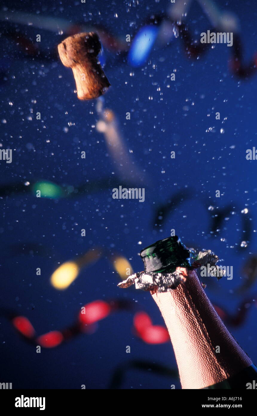 Cork Popping out of Champagne Bottle Stock Photo