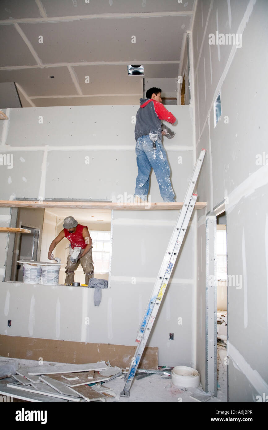 Immigrant Worker Applying Drywall Joint Compound Building 1 Stock Photo ...