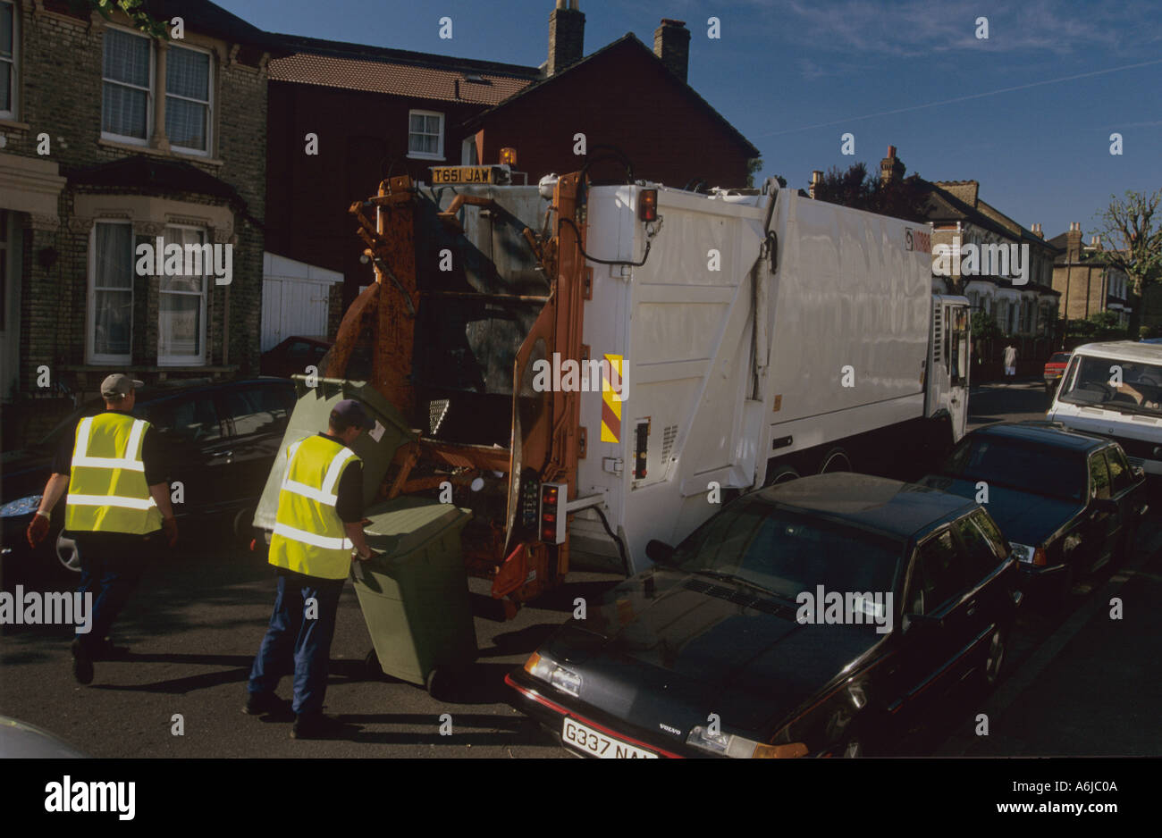 Refuse collection by council workers in Southwark London UK Stock Photo