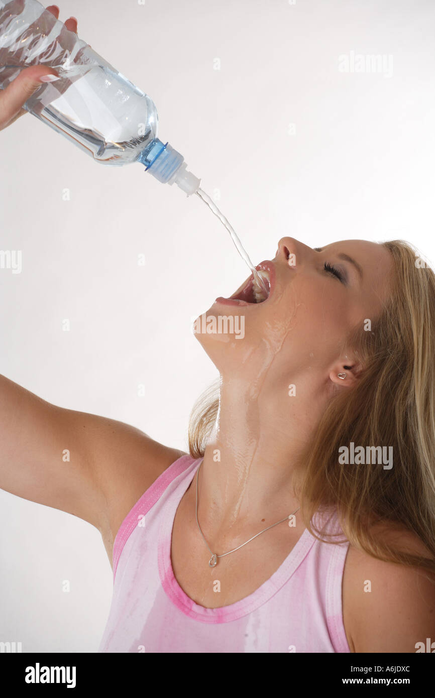 young woman posing during she drinks water Stock Photo