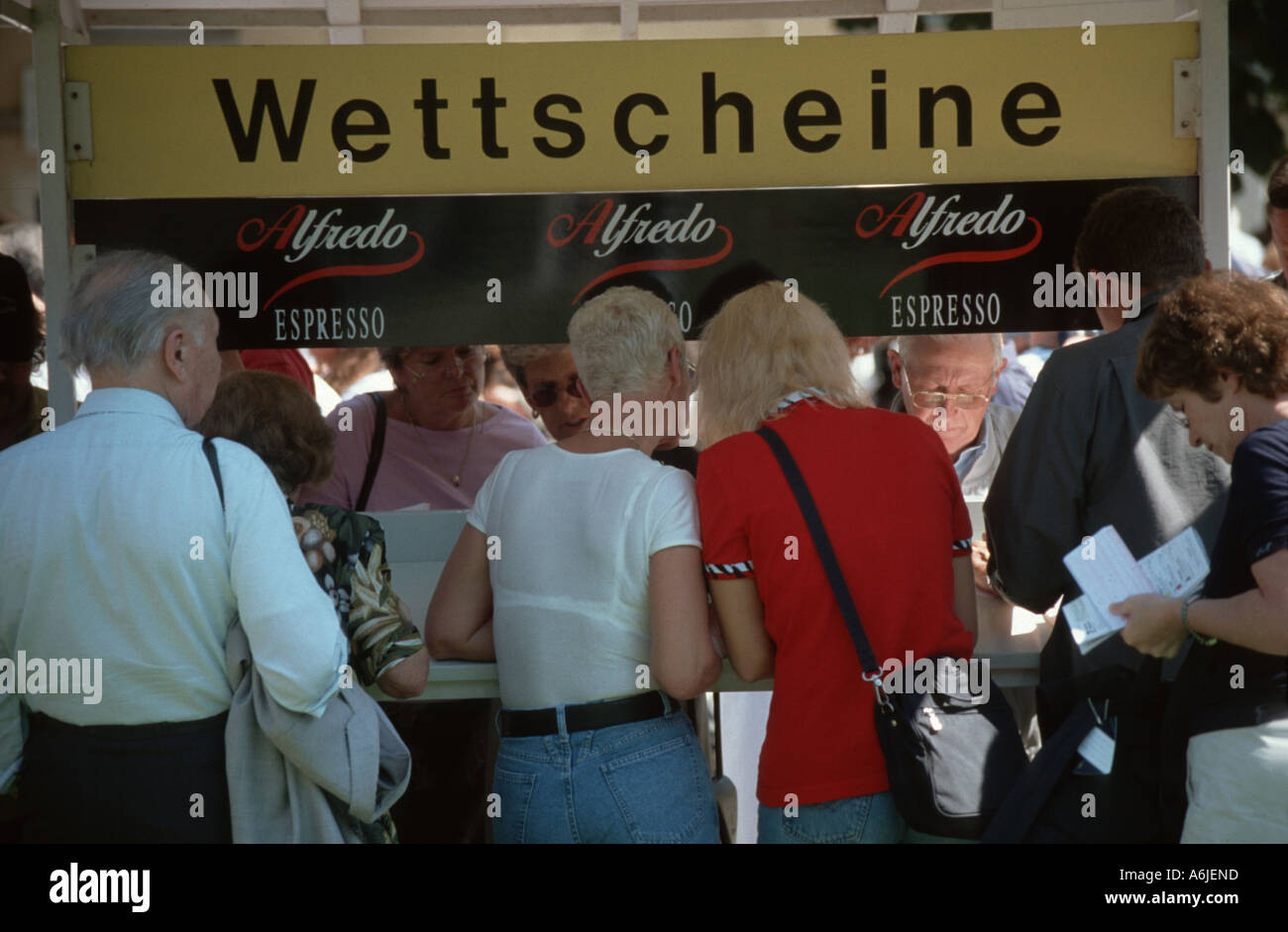 Visitors Filling Out Forms For Betting At A Horse Racing Germany