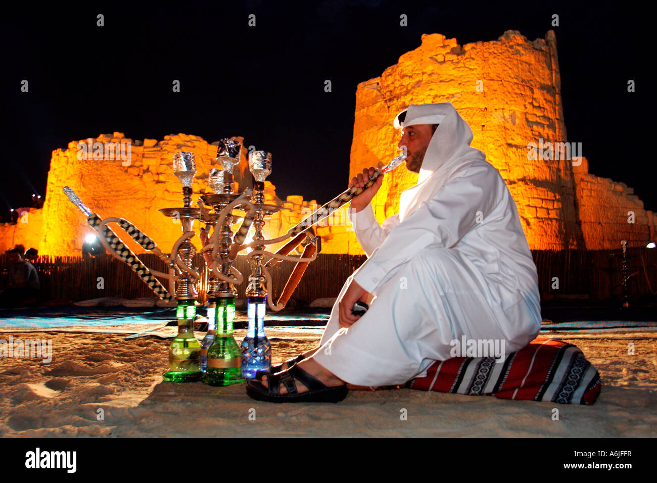Man smoking a water pipe, Dubai, United Arab Emirates Stock Photo