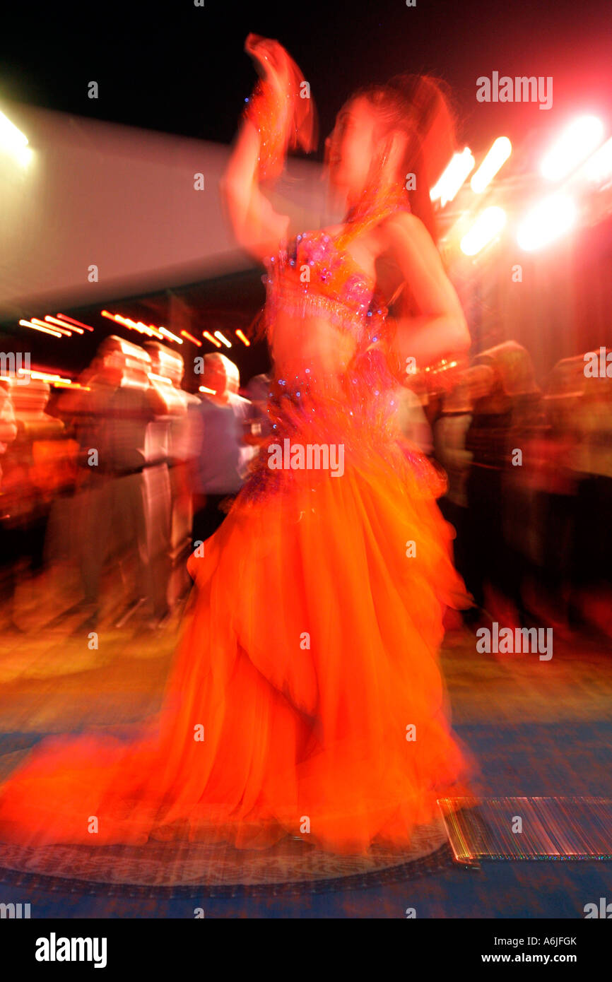 A dancing Arabian woman in traditional costume, Dubai, United Arab Emirates Stock Photo