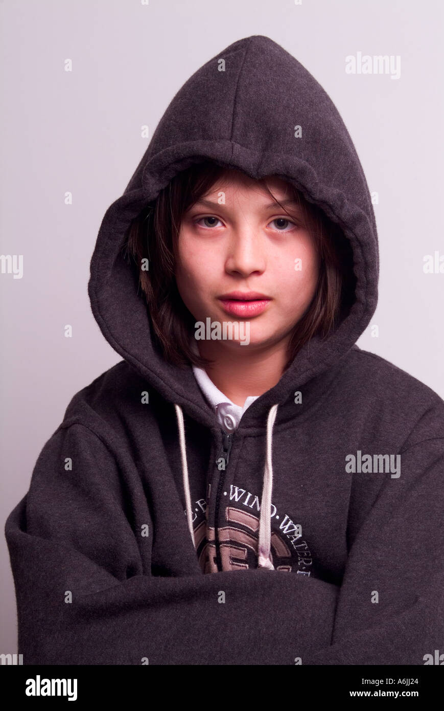 Handsome young 12 year old boy wearing a hoodie Stock Photo