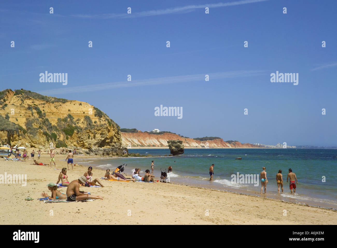 Portugal, the Algarve, Olhos de Agua beach with tourists sunbathing Stock Photo