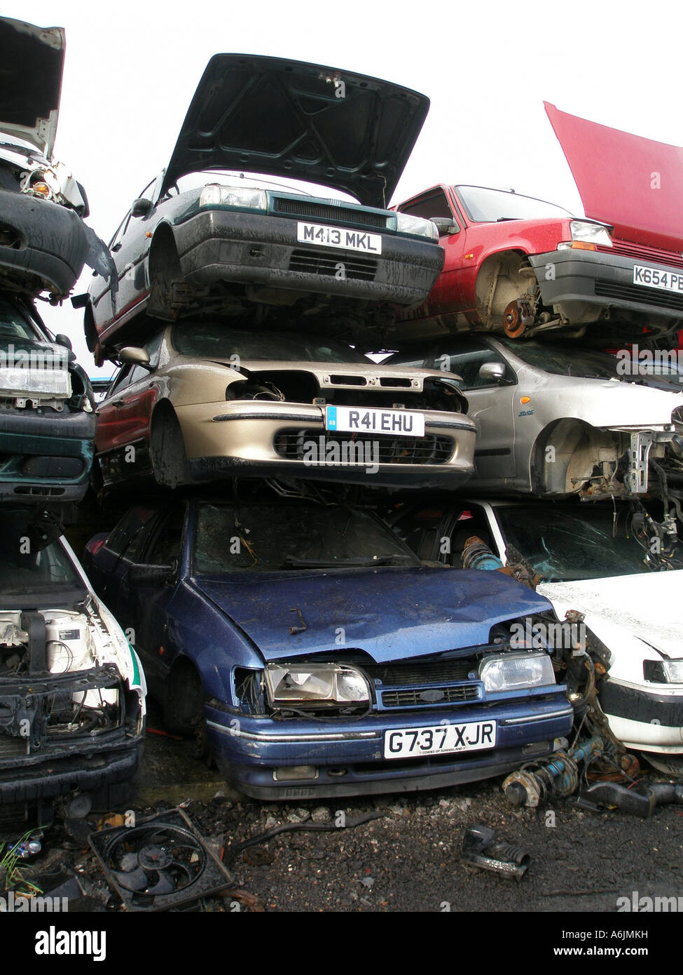 cars stacked up in a  scrap yard Stock Photo