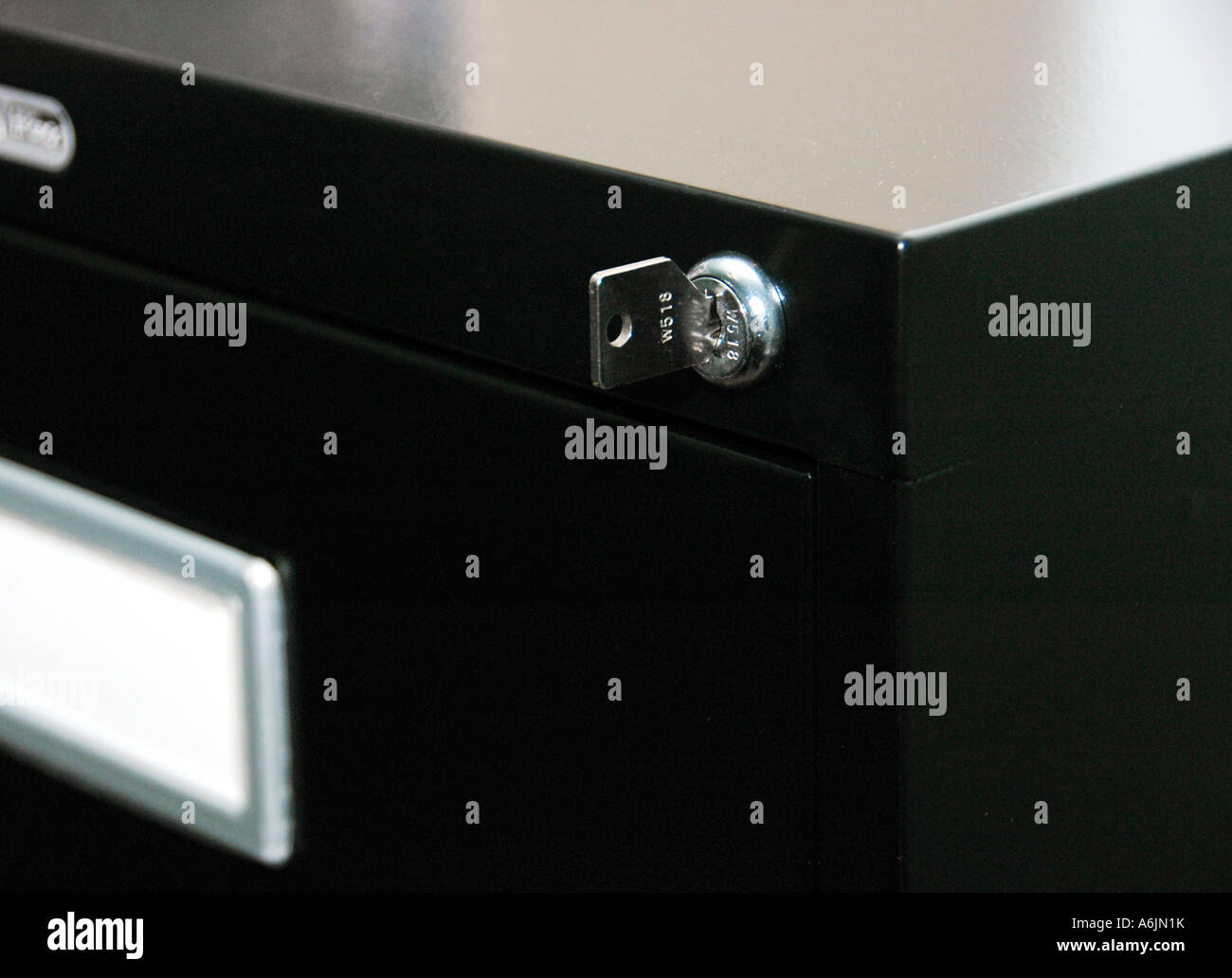 Key to unlock black filing Stock Photo Alamy