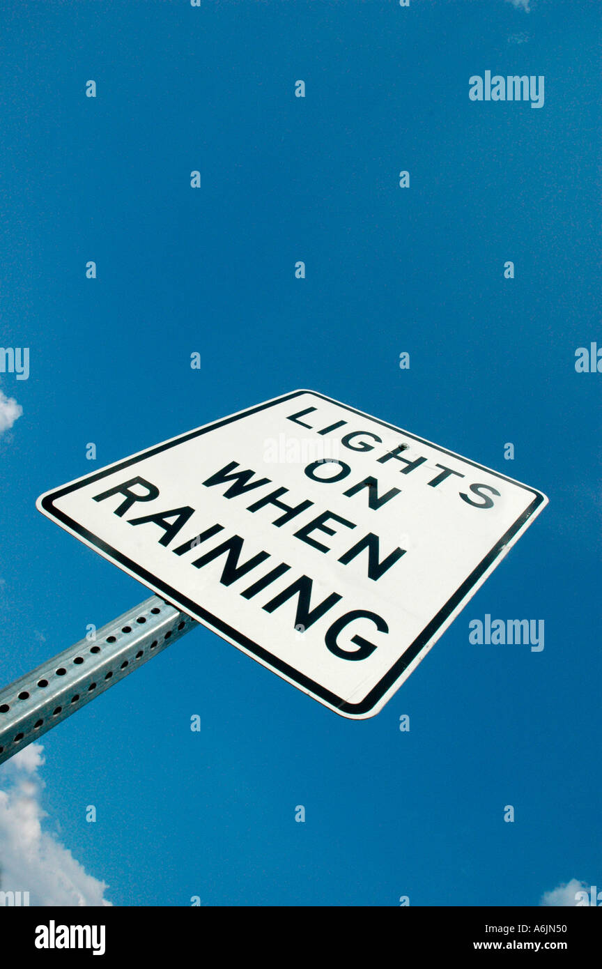 Headlight turn on sign warning on USA highways when raining Stock Photo