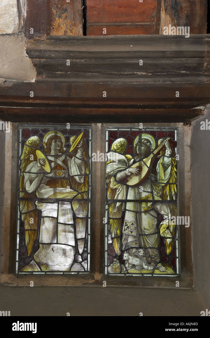 Stained glass windows depicting two musical angels in Church of All Hallows at Tillington West Sussex. Church was built in 1807 Stock Photo