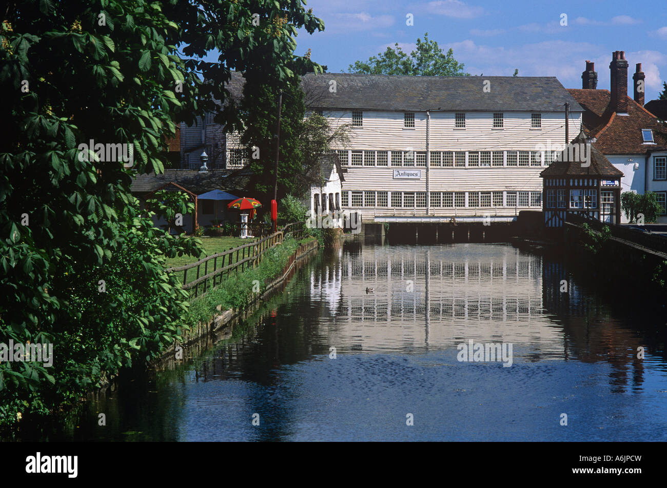Weather boarded watermill on the river Colne in the centre of the