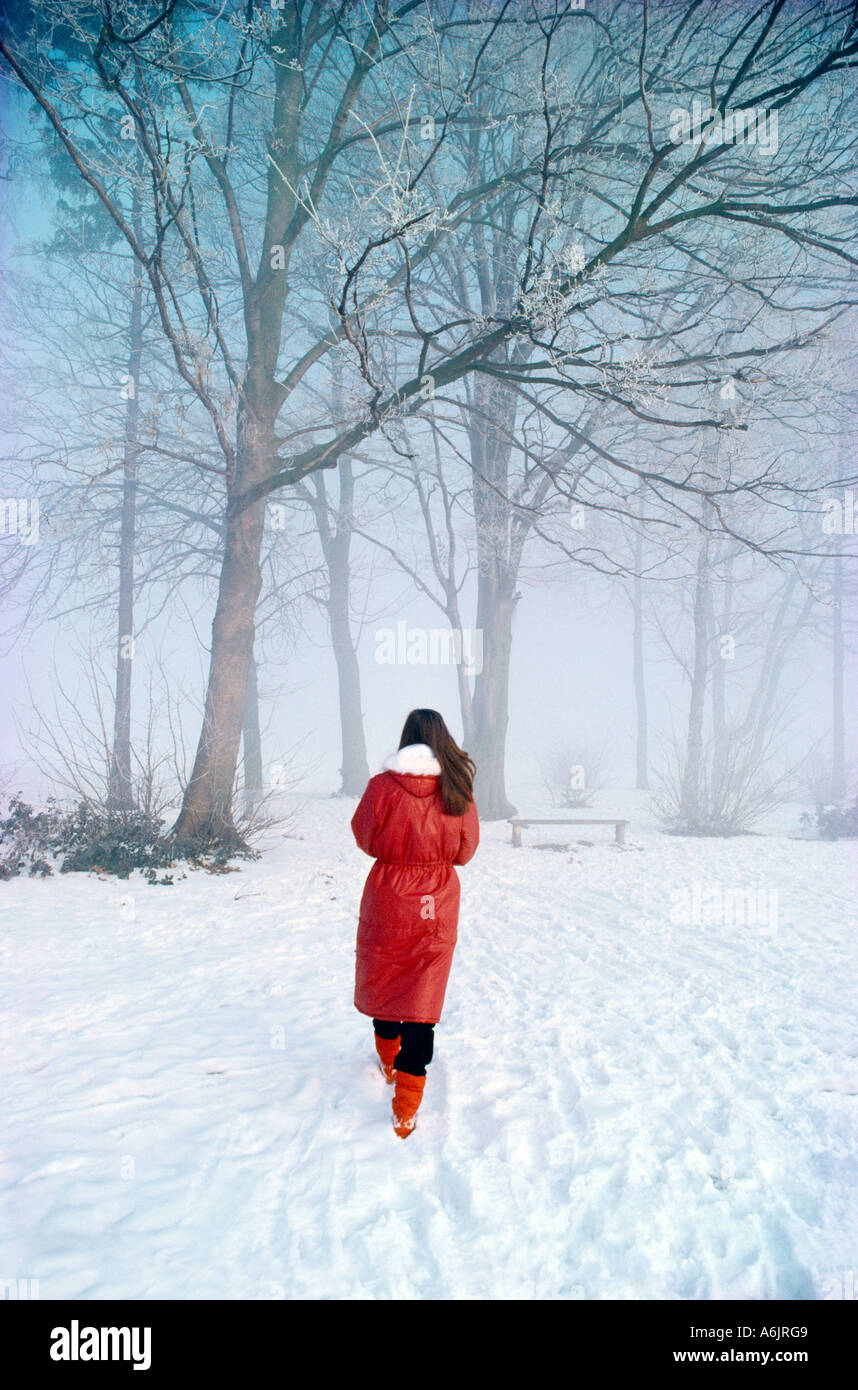 Woman snow rear view red coat hi-res stock photography and images - Alamy