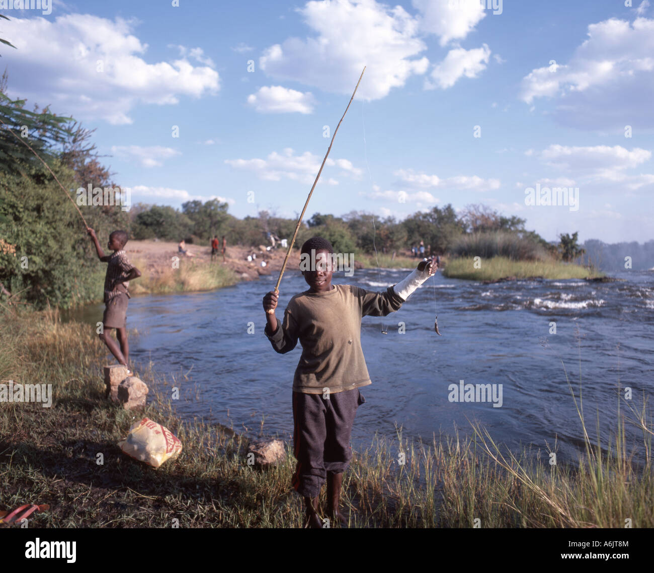 Boy's fishing, Victoria Falls (Mosi-oa-Tunya), Livingstone, Southern Province, Zambia Stock Photo